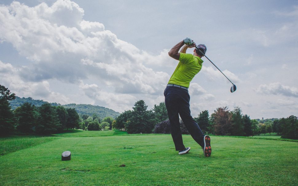A person taking a golf swing