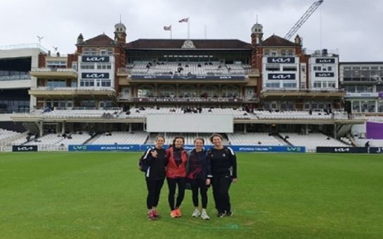 4 women standing in front of The Oval in Kingston