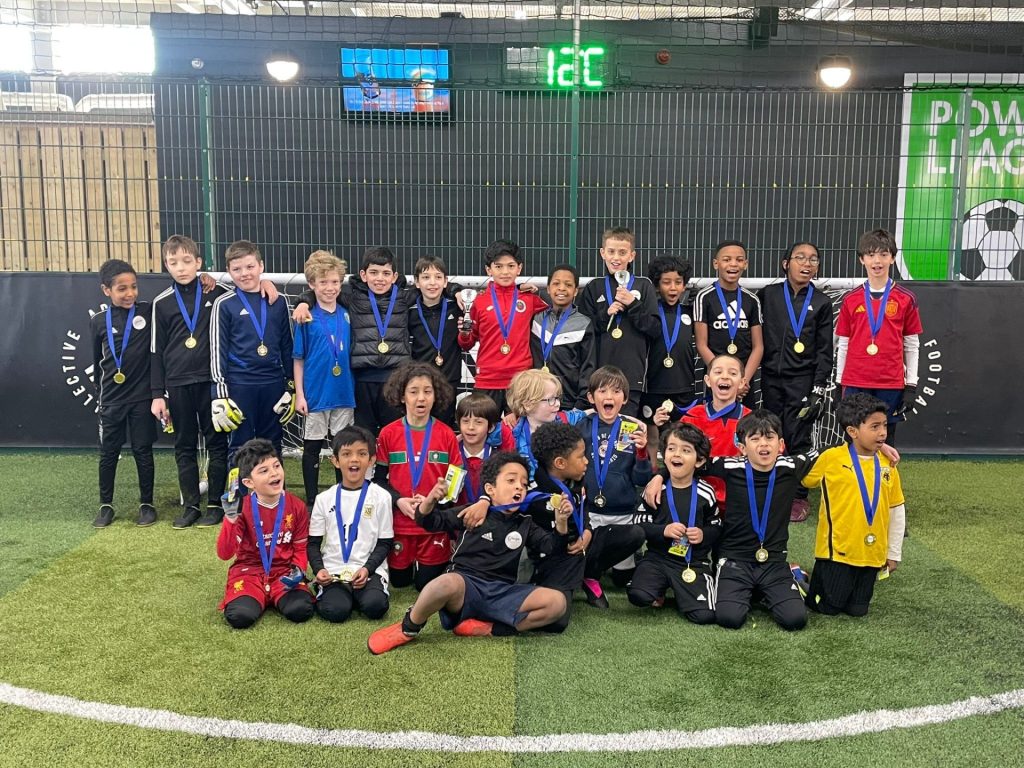 Ginga Soccer School players present their trophies and medals at the end of a holiday camp