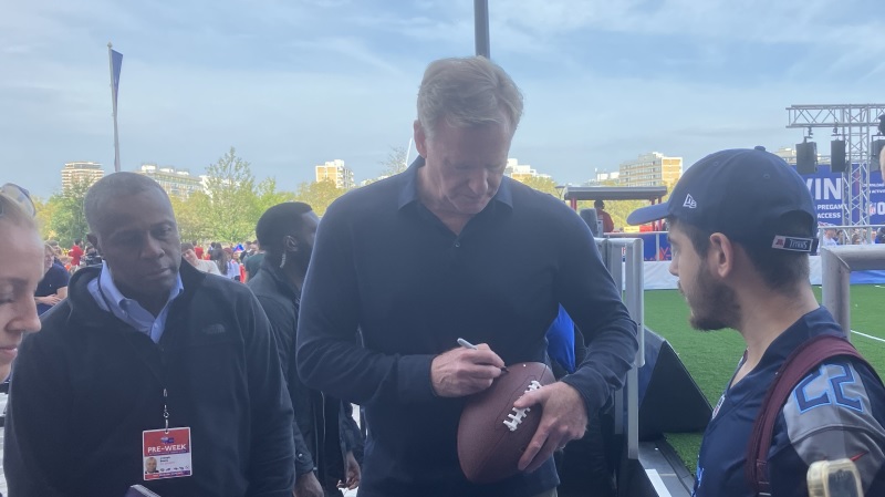 NFL Commissioner Roger Goodell signs autographs at NFL Experience London