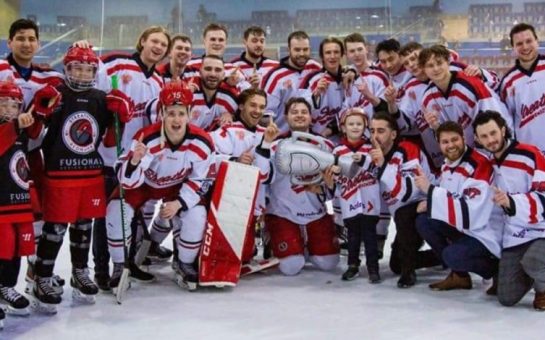 Streatham ice hockey club pose with super-fan Mickey Pickett after winning a trophy