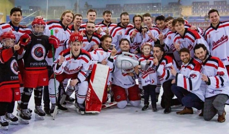 Streatham ice hockey club pose with super-fan Mickey Pickett after winning a trophy