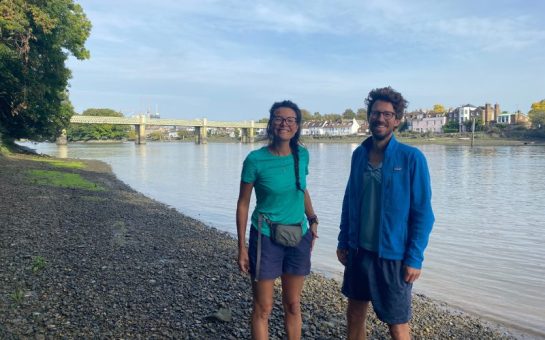 Li An Phoa and Maarten van der Schaaf standing on the bank of the Thames