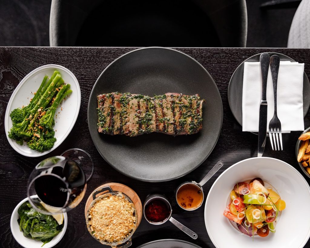 Steak on tabled with sides