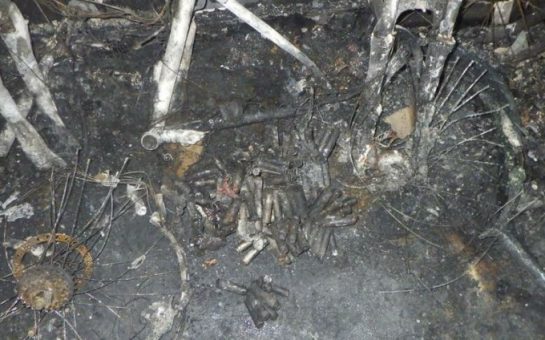 e-bike fire wreckage in Kingston, ashes and remaining bike parts