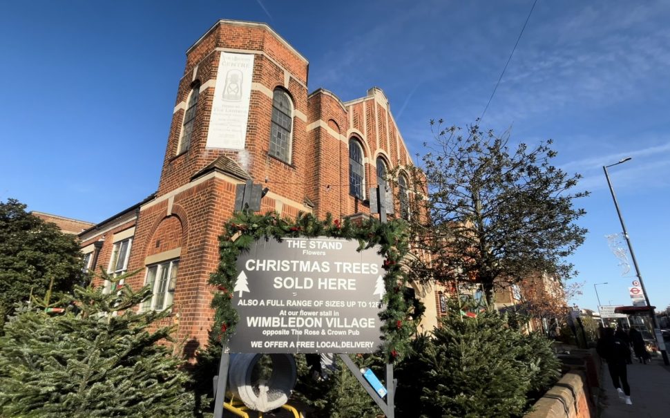 Picture shows Lantern Arts Centre and Methodist Church, with a sign for Christmas trees being sold outside their Christmas celebration event.