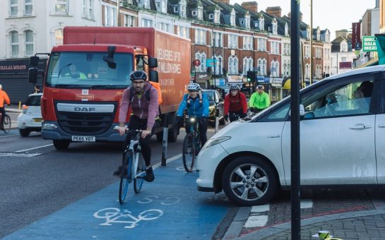 Cyclists on Ansell Road junction with Upper Tooting Road at rush hour