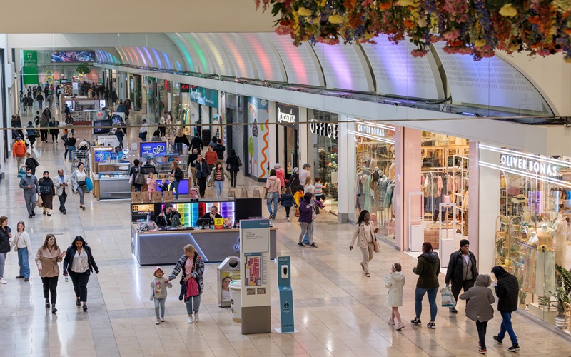 Inside of a shopping centre with lots of people