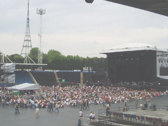Photo of a Coldplay concert at the Crystal Palace Athletics stadium with the landmark Crystal Palace tower in the background.