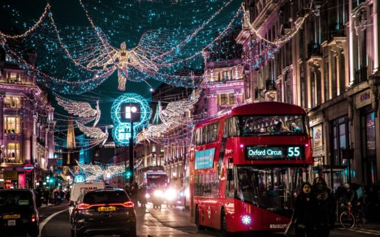 London cover in bright Christmas lights with a red bus