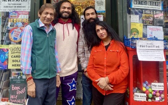 The Patel's outside their shop