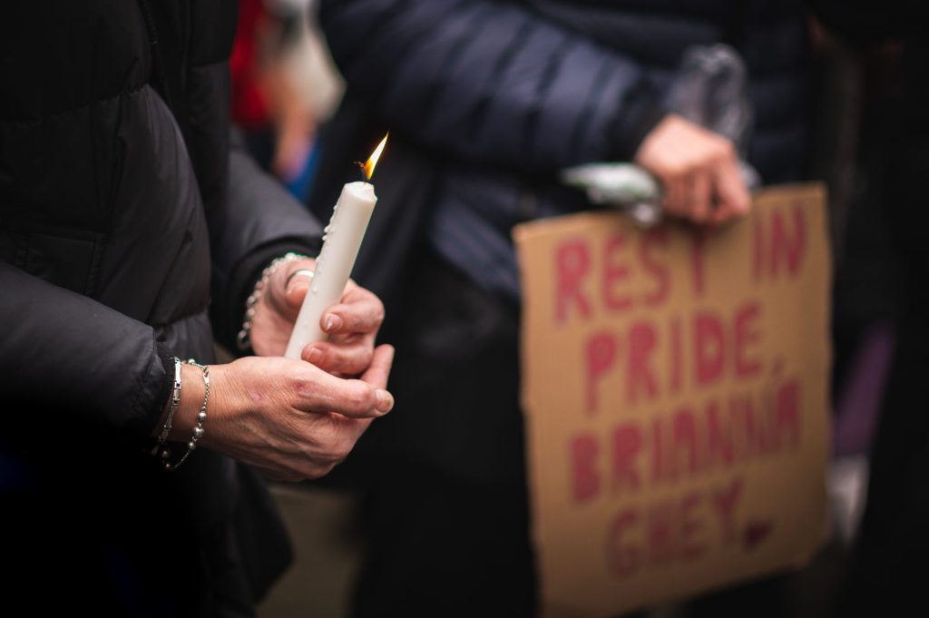 A picture of a candle, lit at a vigil, to pay tribute to and in memory of 16-year-old Brianna Ghey who was brutally murdered by two teenagers in a park in Cheshire on 11 February 2023.