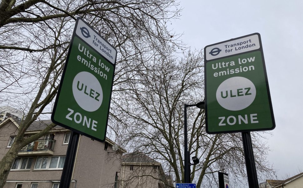 Two green signs with a white circle saying ULEZ to mark the start of a ULEZ zone