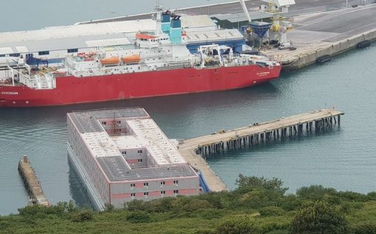 Long-shot image of Bibby Stockholm barge in Portland Pier