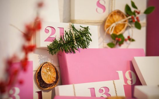 Pink and white christmas advent calendar and wrapped gifts
