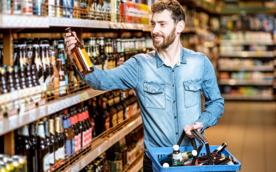 Person holding a bottle of alcohol free beer