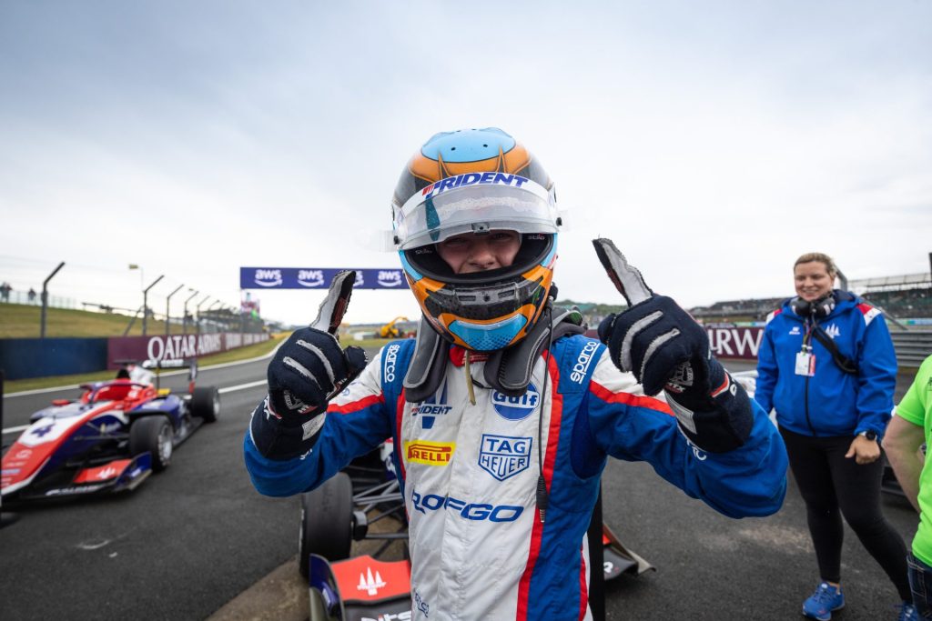 Goethe celebrating his silverstone victory after getting out of his car in the Formula 3 British GP.