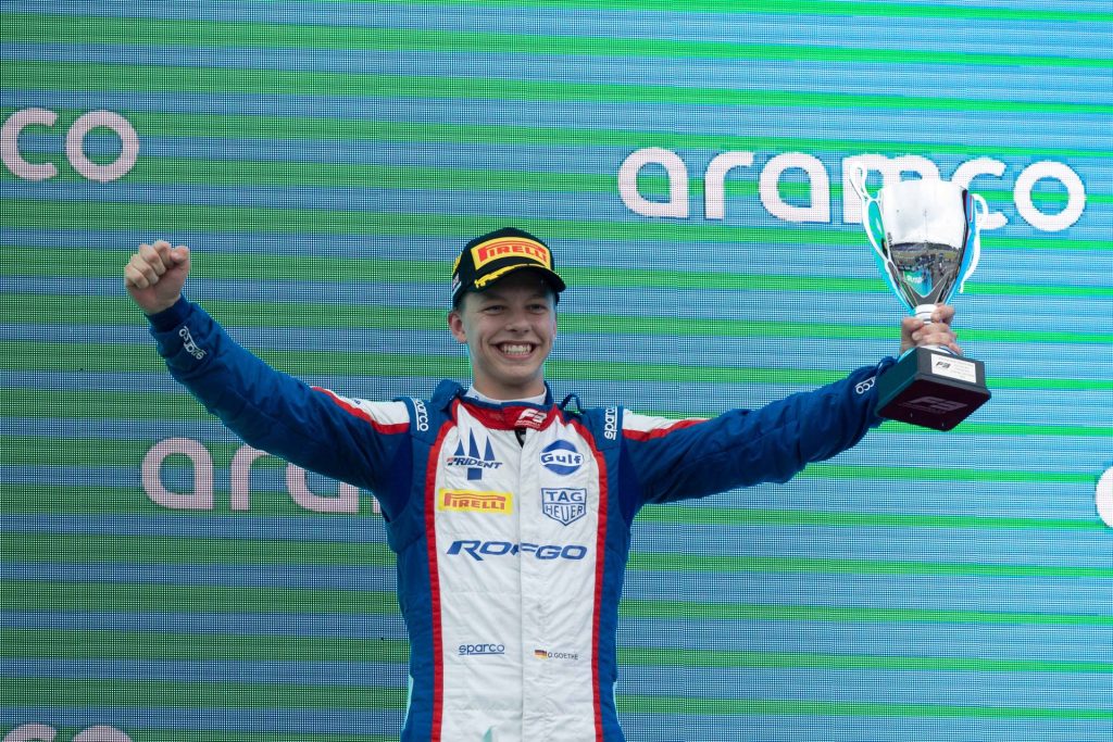 Goethe on the top of the podium celebrating his silverstone victory in Formula 3.