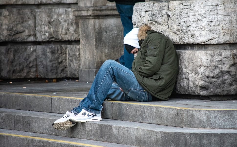 A young boy homeless on the streets of London