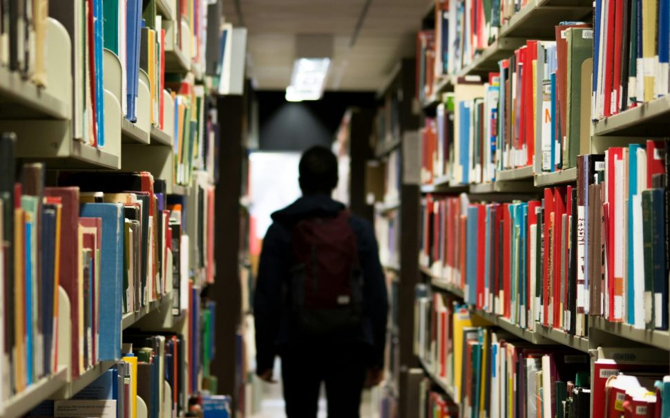 Student walking in library