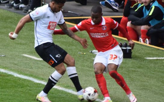 Ademola Lookman playing for Charlton Athletic against Derby