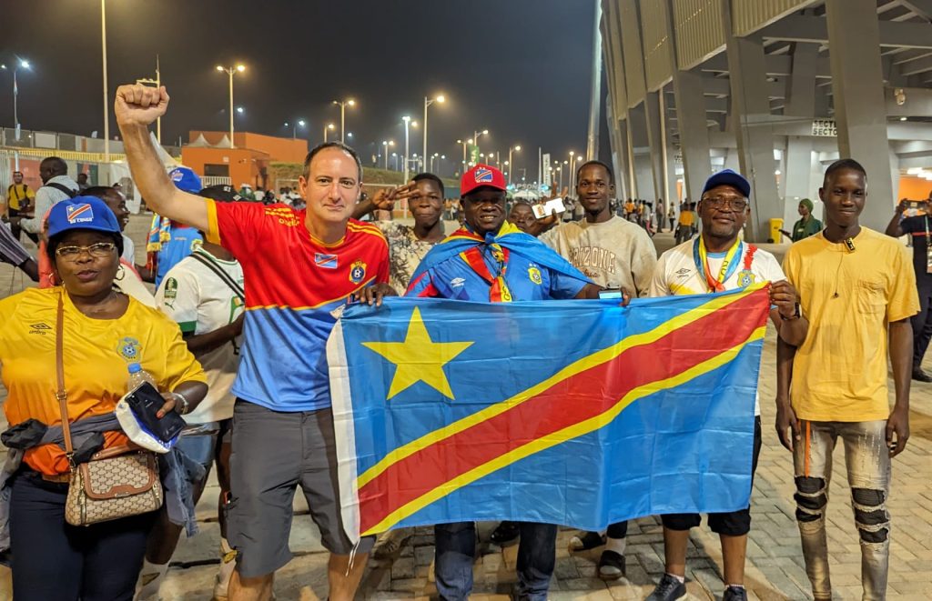 Matt Walker (Left) celebrating with DR Congo fans
