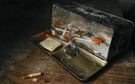 A heroin injecting kit containing syringes and a spoon