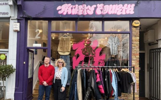 Man and woman outside shop front