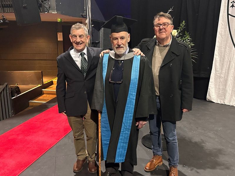 Dr Marjot accompanied by his son and son-in-law on his graduation day