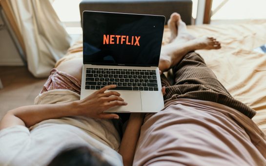 Couple watching Netflix on bed