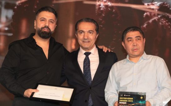 Winner of Chef of the Year at The British Kebab Awards, Mazlum Demir poses with his award.