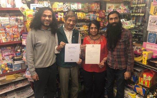 The Patel family with their award