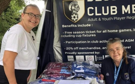 Julie Burgess with the Club Merchandise at last year's community day.