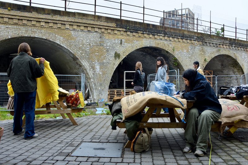 Five volunteers work hard on the outdoor cinema construction. 
Credit - Kingsley Bishop