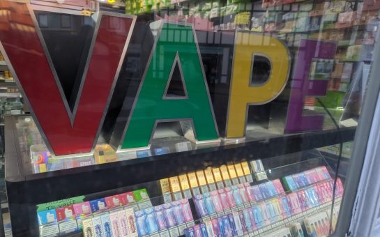 Image of vapes for sale under big colourful block letters that say V A P E