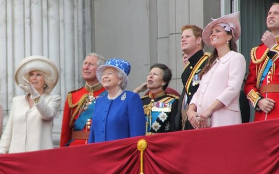 The royal family standing on a balcony