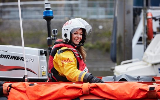 RNLI Crew Member sat in boat