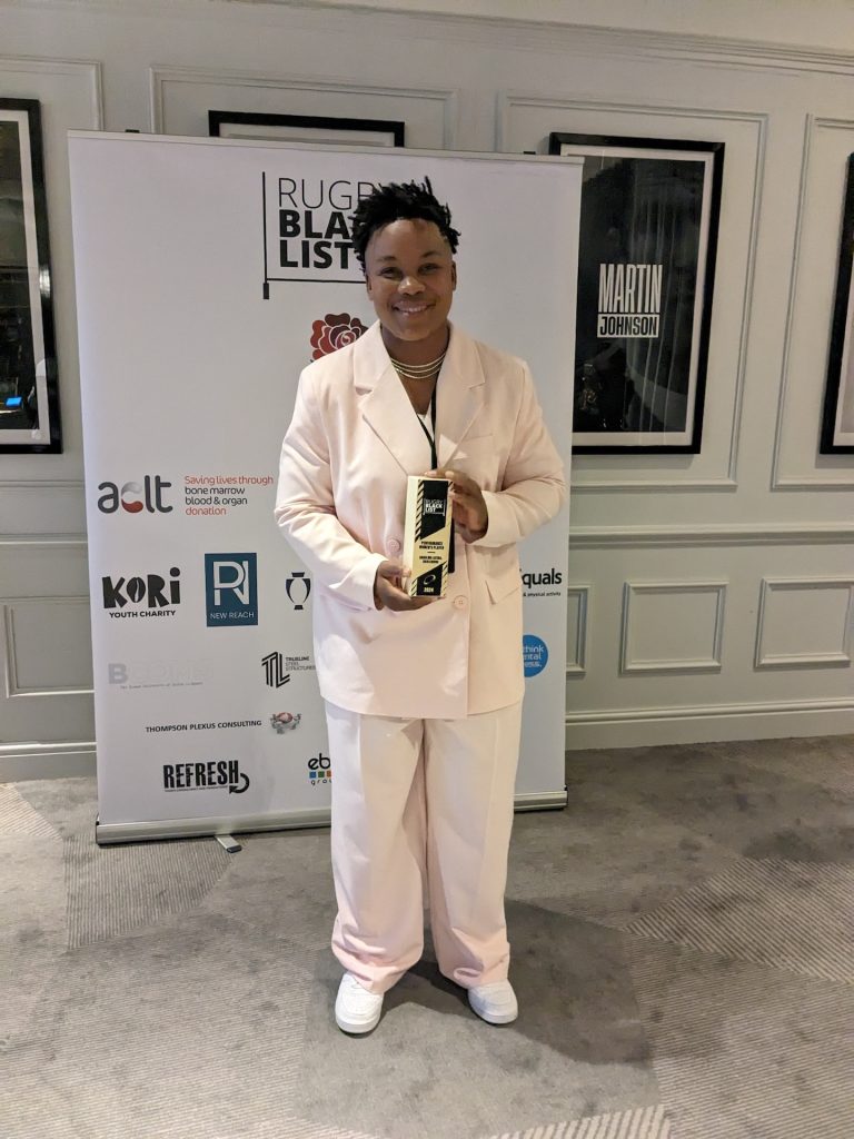 Babalwa Latsha of Harlequins holding her Rugby Black List award