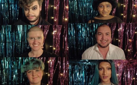 Trans and non binary performers stand in front of the trans flag colours of Trans Day of Visibility at the Oval Tavern in Croydon