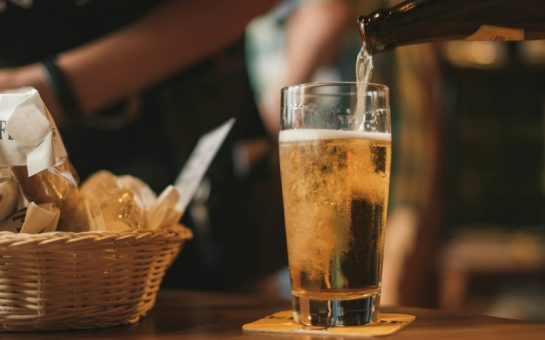 A pint of beer and a basket of food