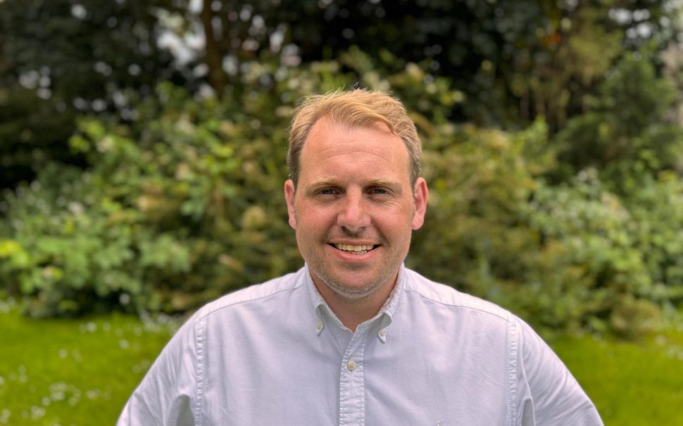 Lib Dem candidate for Sutton and Cheam smiling at camera