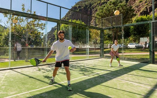 Two people playing padel