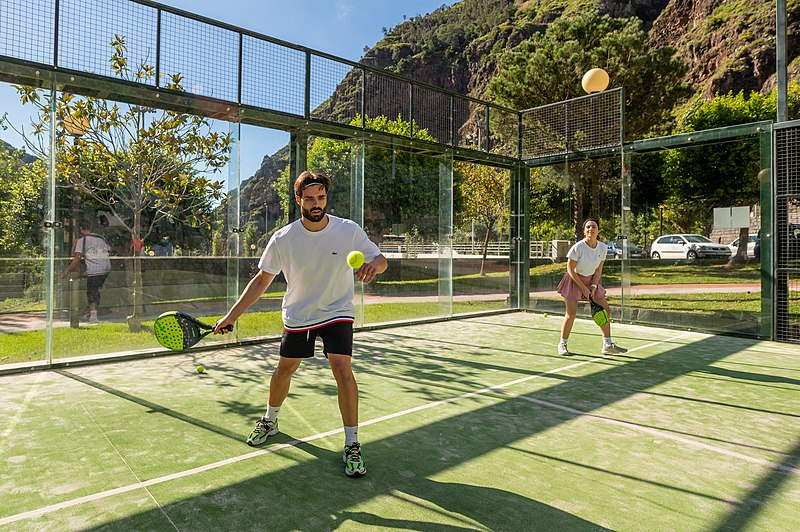 Two people playing padel