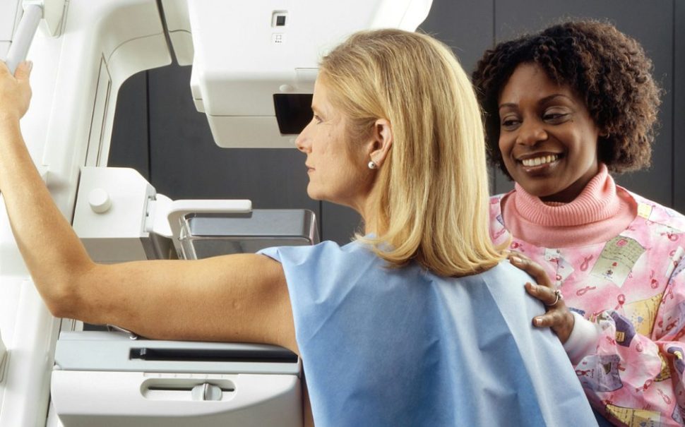 Woman having a mammogram scan done