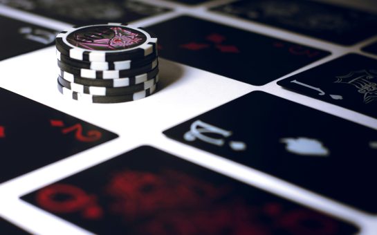 Poker chip on a white surface (Credit: Free to use from Unsplash)