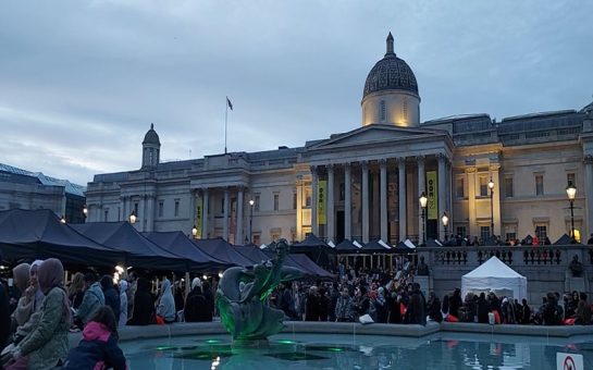 A shot of Trafalgar Square, looking back towards the National Art gallery, with the blue fountain pool in the foreground.