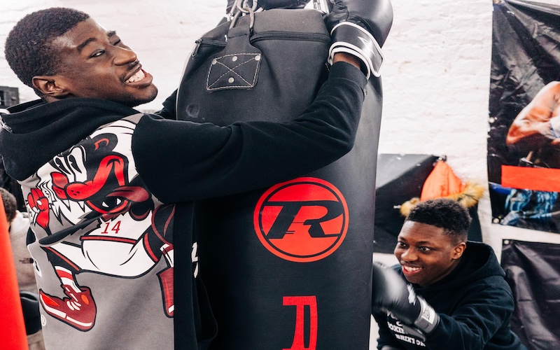 Kevin and Miles, participants at the teen/adults session of Boxing for Autism, working with punching bags at Miguel's gym. (Picture credit: Mark Chilvers)