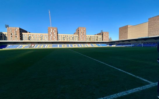 Pitchside interior view of an empty Plough Lane, home of AFC Wimbledon.