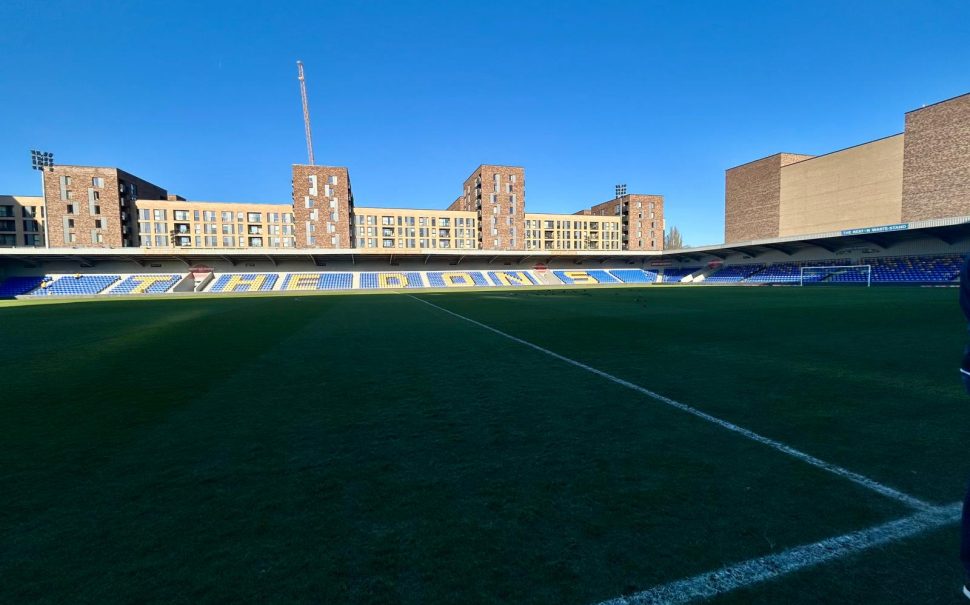 Pitchside interior view of an empty Plough Lane, home of AFC Wimbledon.