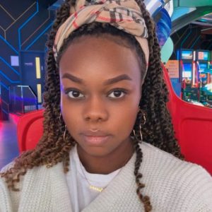 A selfie of Joanne Nattendo in a games arcade.
